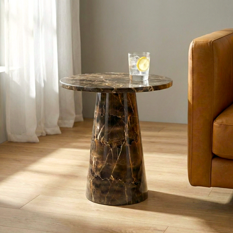 Marble side table with a glass of water and lemon in a living room setting.